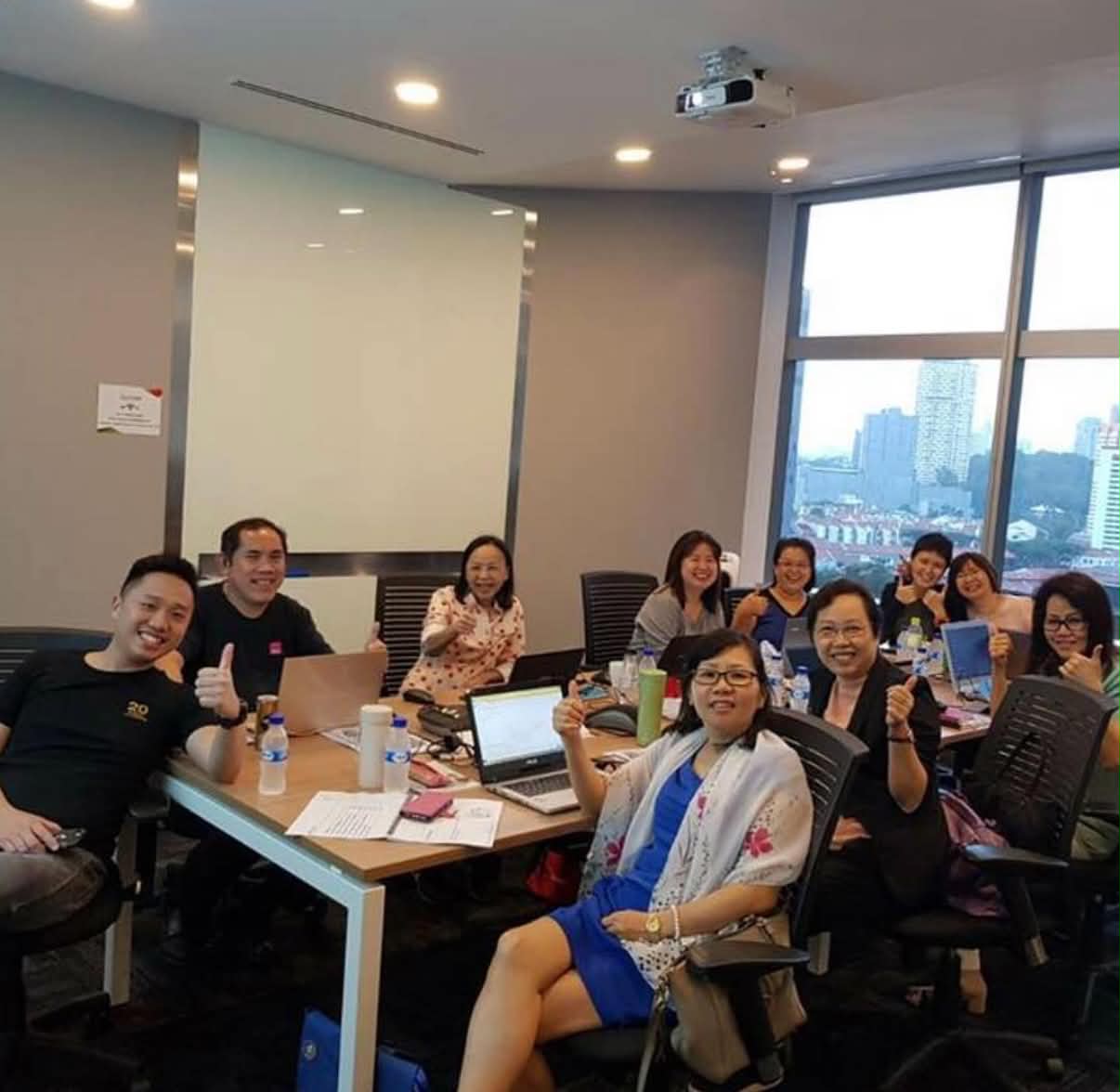 Rieve Ko teaching participants at a live education seminar